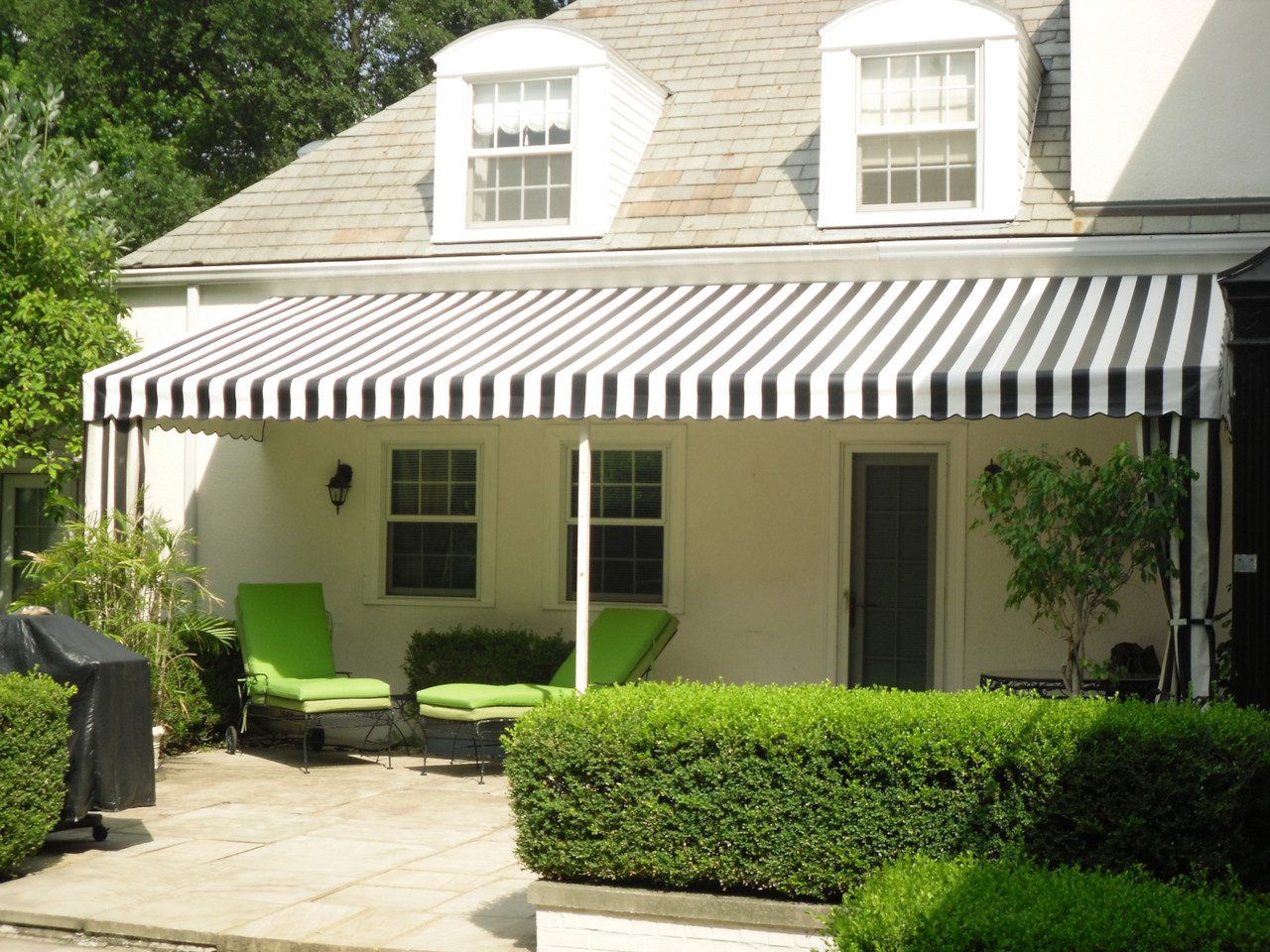 A house with a black and white awning