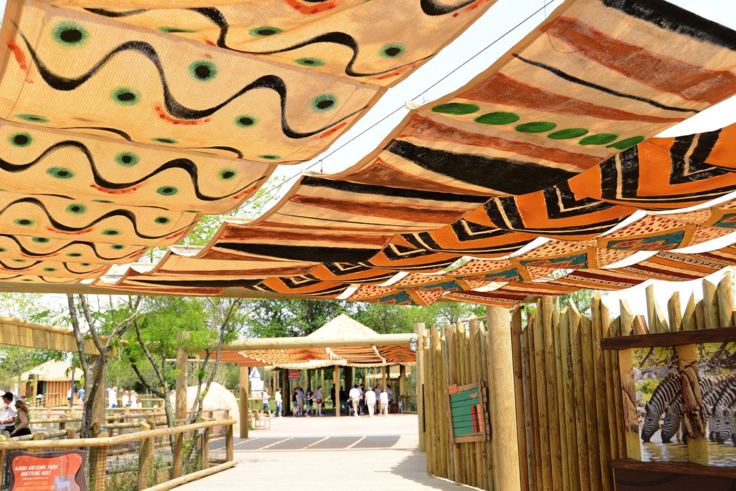 A wooden structure with many different colored fabric.
